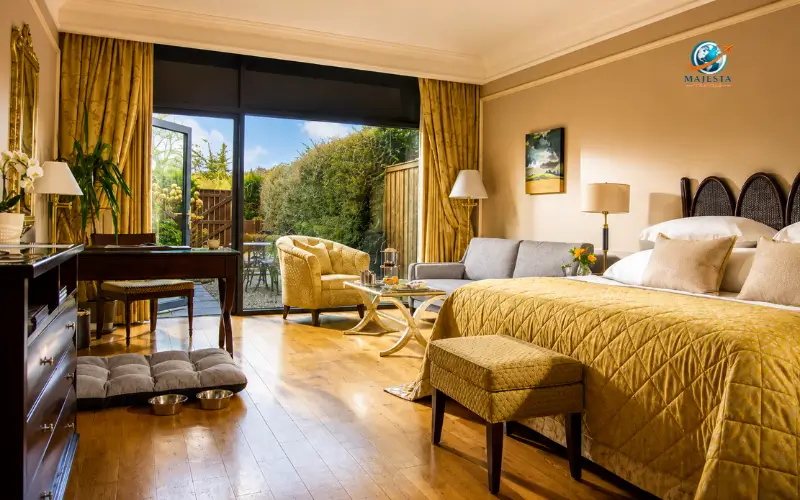 Luxury hotel room with garden view and modern furnishings.